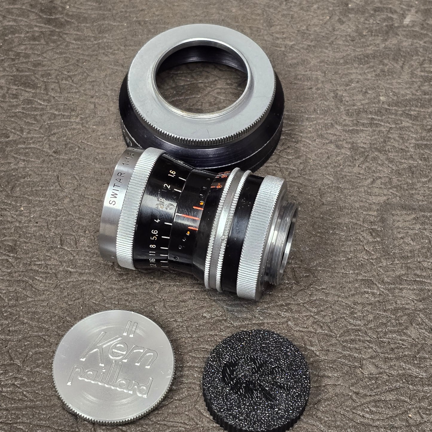 Switar 10mm f1.6 C-Mount Lens S# 1037028 with Bolex Series 6 Lens Shade
