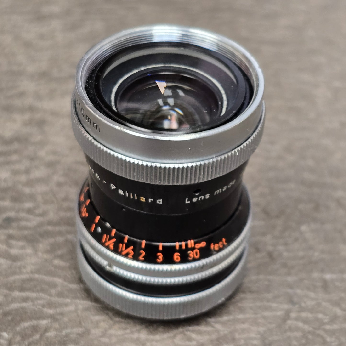 Switar 10mm f1.6 C-Mount Lens S# 1037028 with Bolex Series 6 Lens Shade