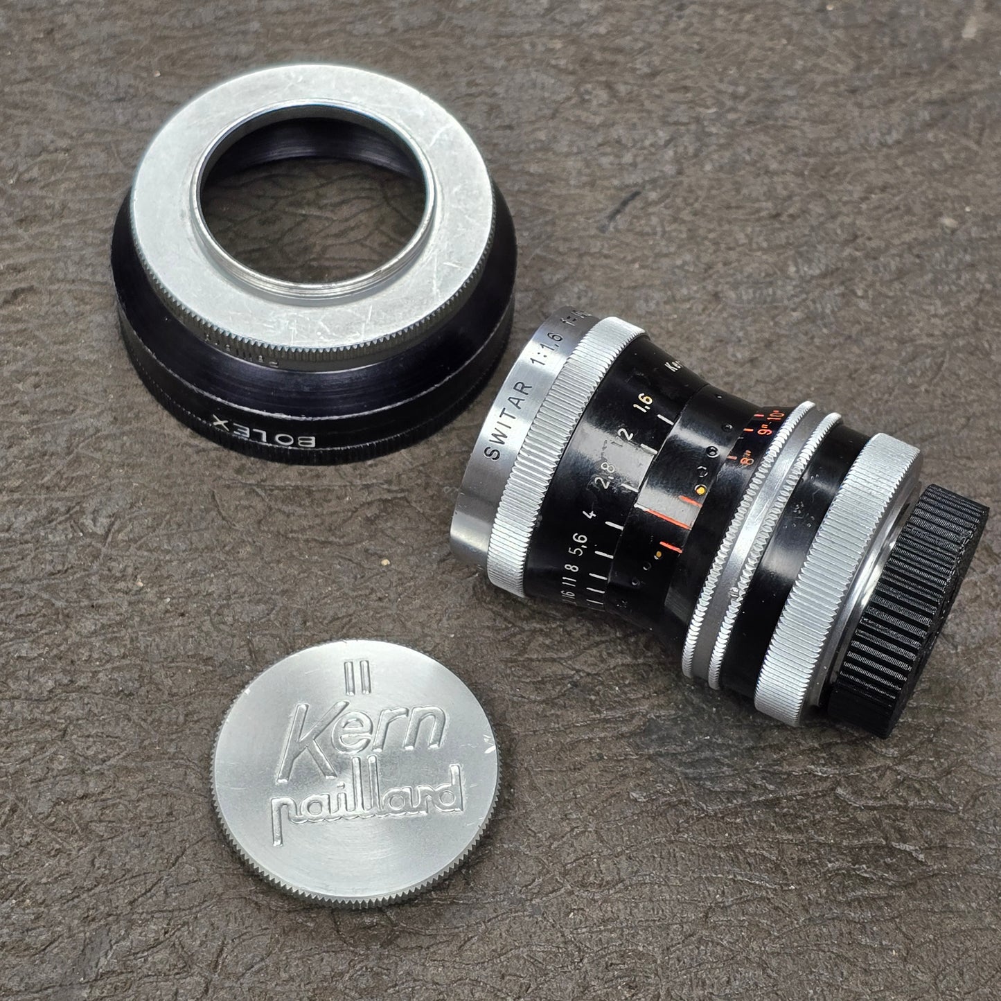 Switar 10mm f1.6 C-Mount Lens S# 1037028 with Bolex Series 6 Lens Shade