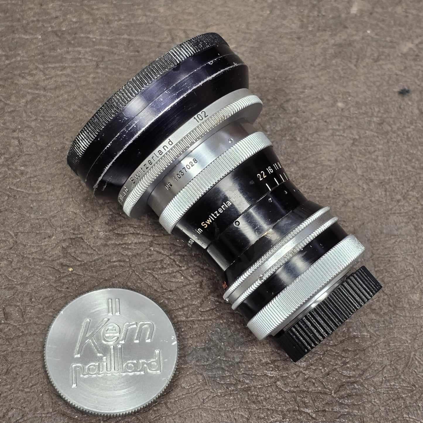 Switar 10mm f1.6 C-Mount Lens S# 1037028 with Bolex Series 6 Lens Shade