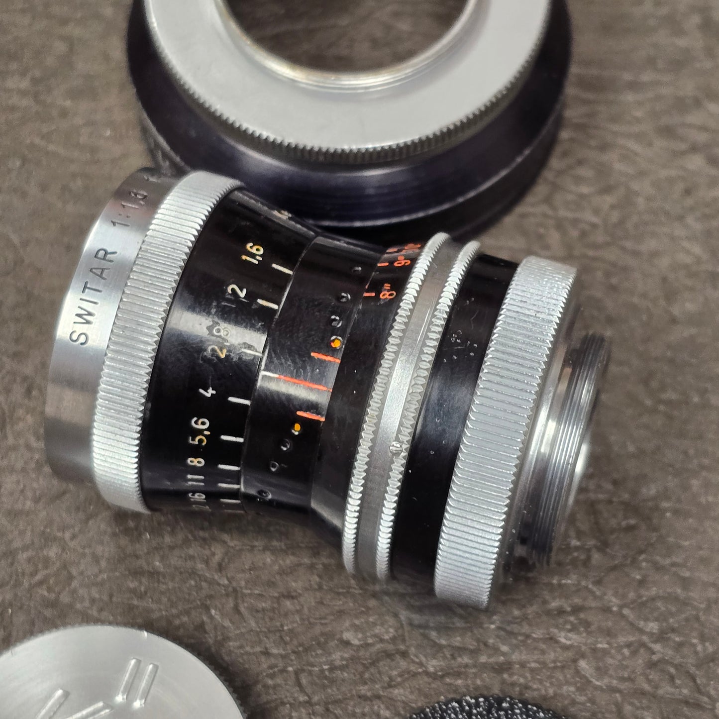 Switar 10mm f1.6 C-Mount Lens S# 1037028 with Bolex Series 6 Lens Shade