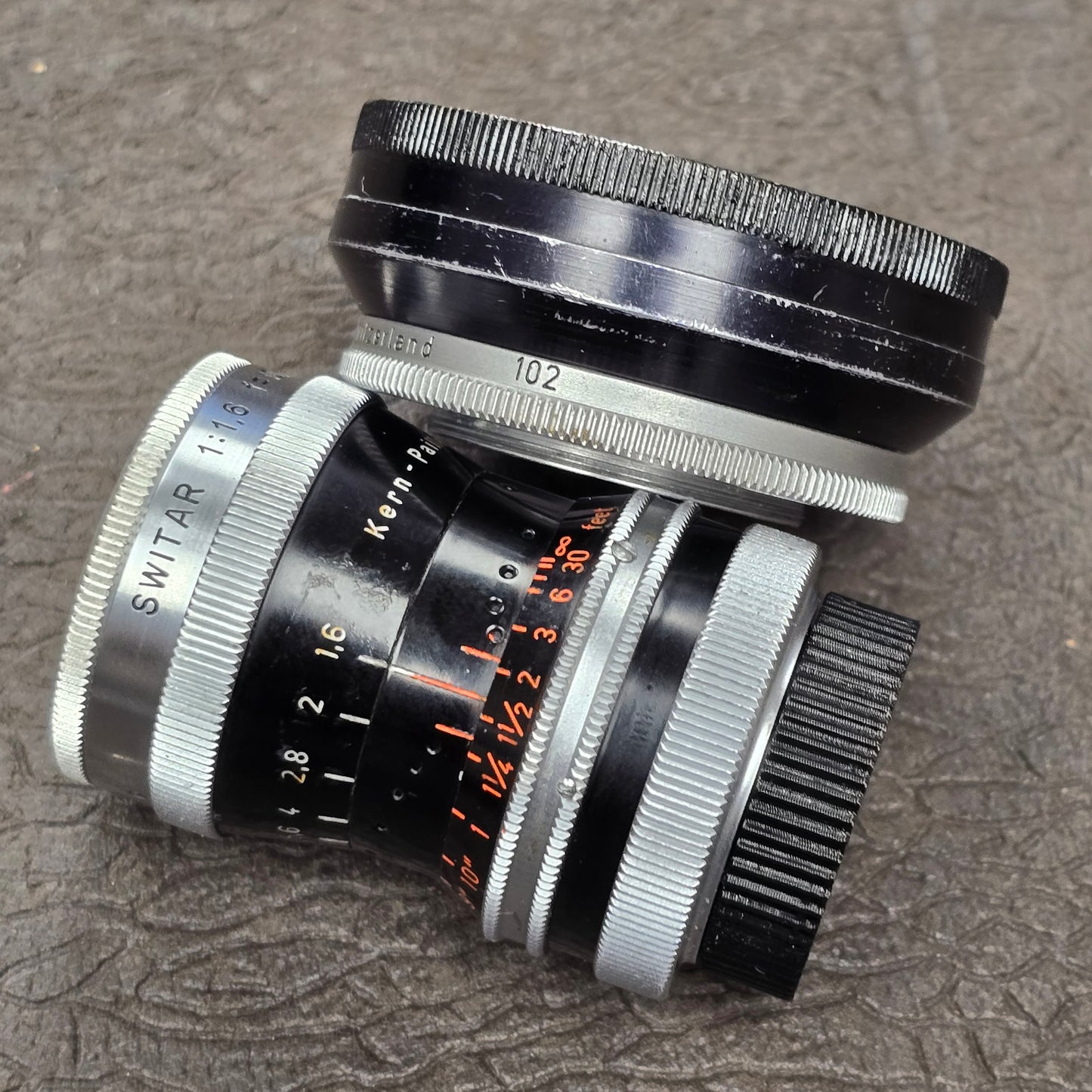 Switar 10mm f1.6 C-Mount Lens S# 1037028 with Bolex Series 6 Lens Shade